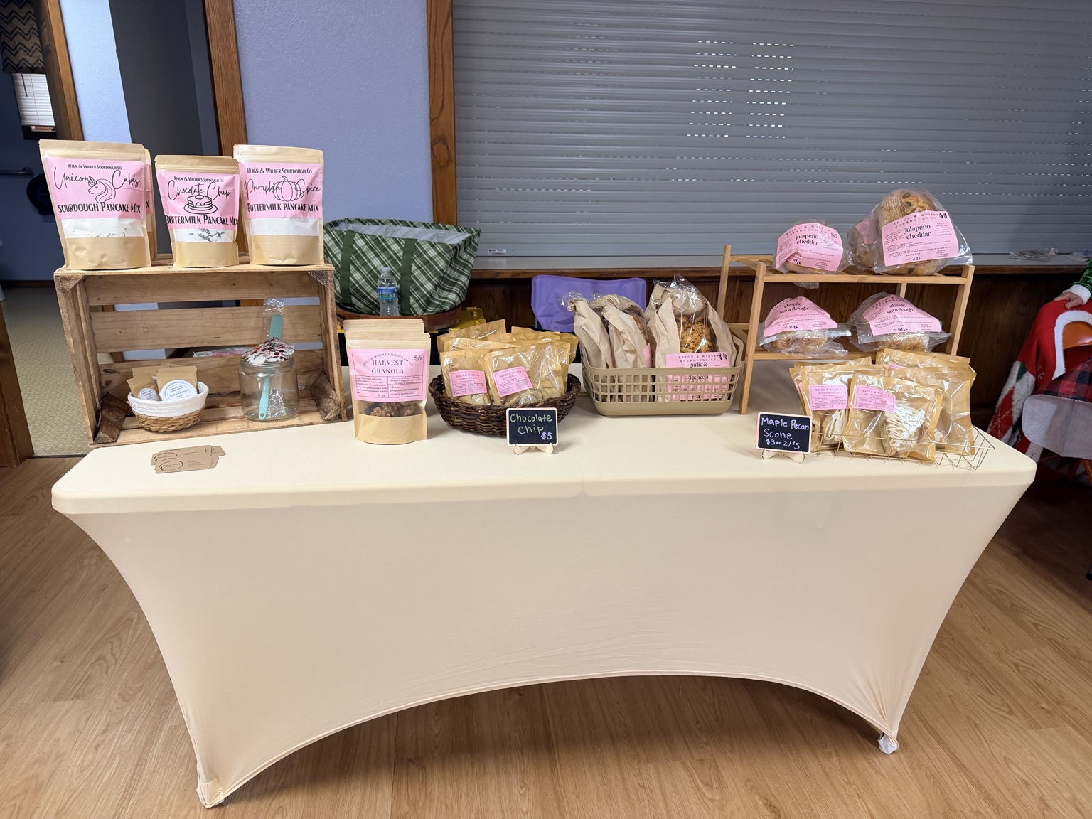 Reign & Wilder market display with fresh sourdough and baked goods at a local event